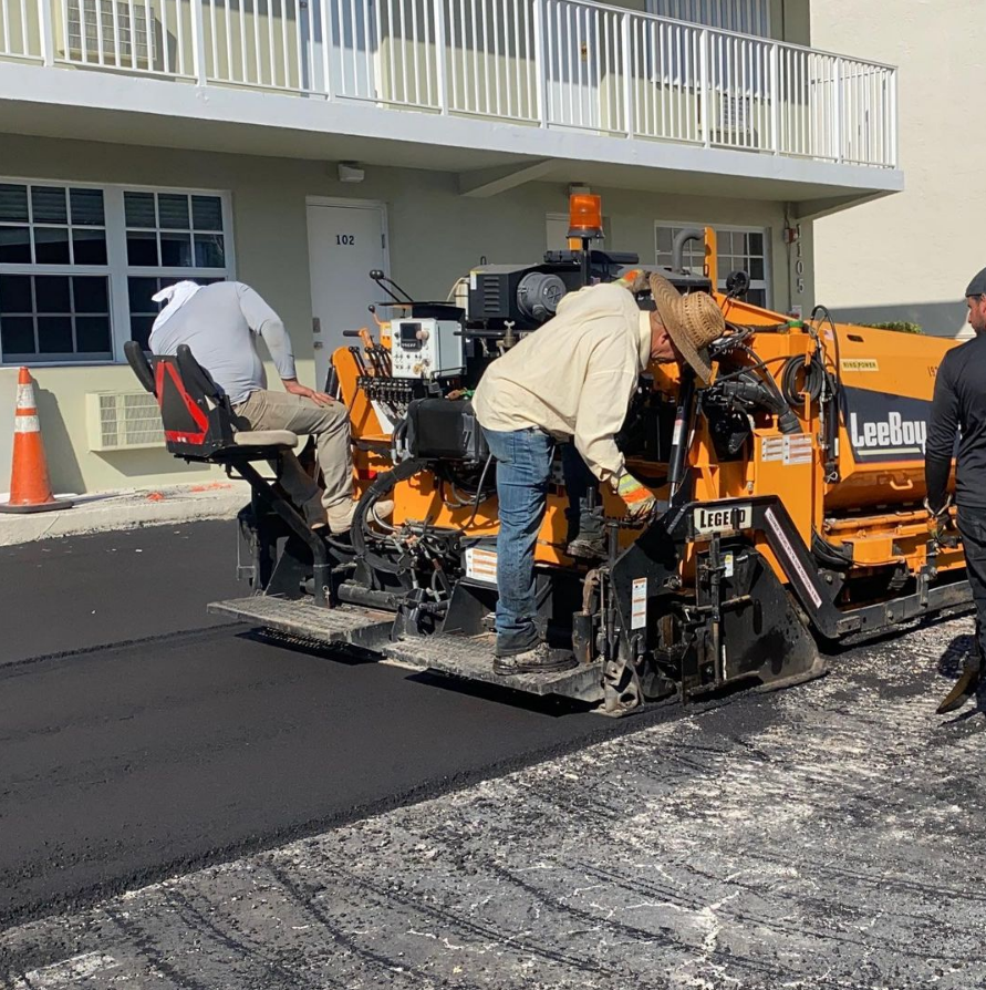 Asphalt milling and overlay paving in progress. Asphalt and Concrete Paving service.