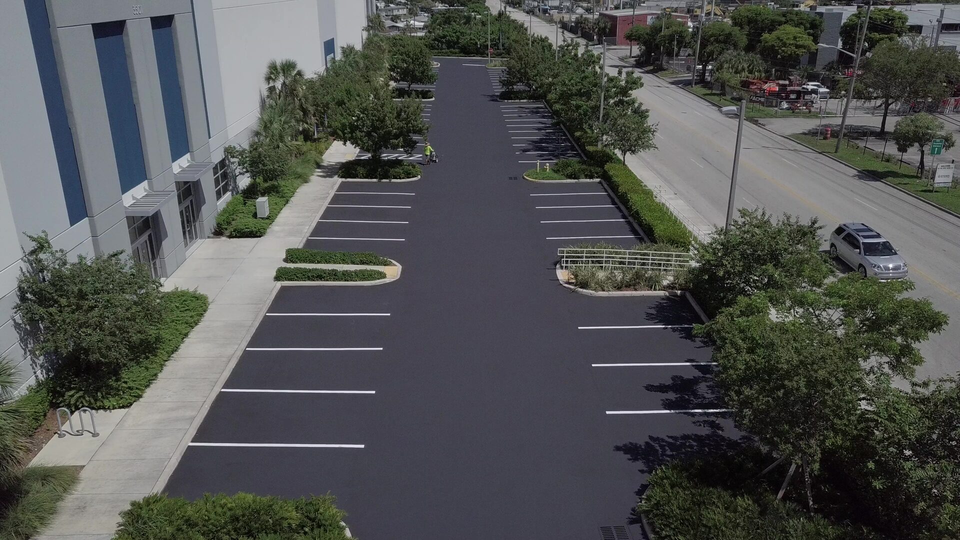 Aerial view of a completed parking lot, before and after